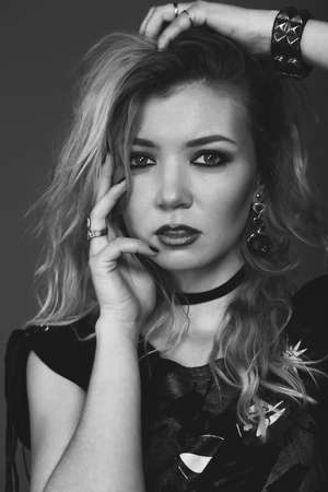 Rock baby. Fashion portrait of a young beautiful girl in the studio