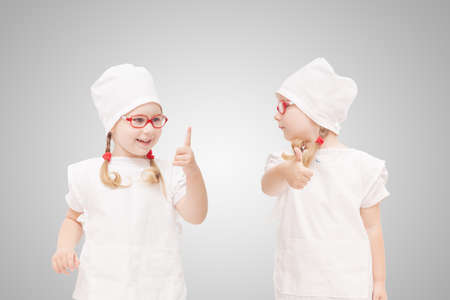 young girl with glasses plays in the doctor as a momの写真素材