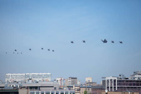 MOSCOW, RUSSIA - MAY 7, 2015: People watching the parade on the roof Office Building. Rehearsal of parade devoted to May 9, 70-th Victory Day in World War II. May 7, 2015 in Moscow.のeditorial素材
