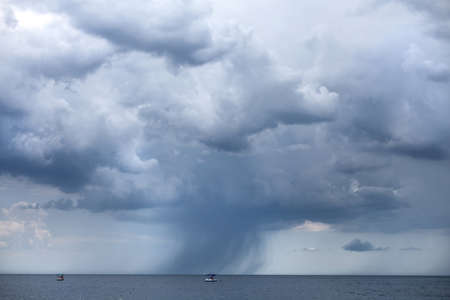 lonely boat in the open sea, bad weather, a sense of danger
