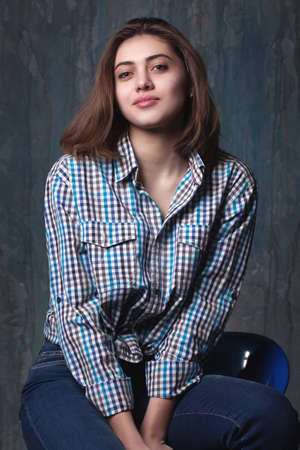 portrait of a beautiful young girl in the roomの写真素材