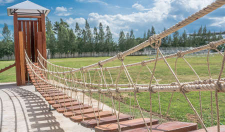 small rope  bridge in the public playground and blue skyの写真素材