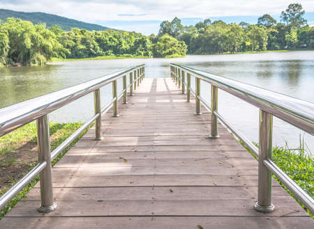 stainless steel bridge or pier at lake constance   see the mountain