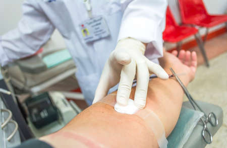 Close up of a patient transfused blood in hospital