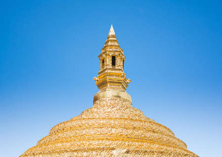 golden statue with blue skyの写真素材