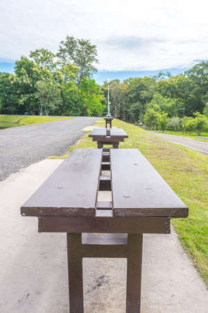 wooden park bench at a forestの写真素材