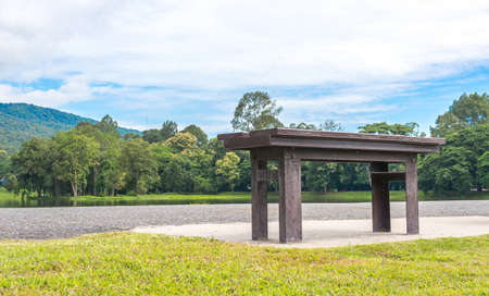 wooden park bench at a forest