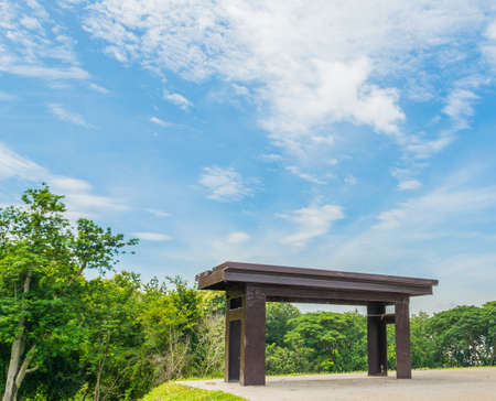 wooden park bench at a forest