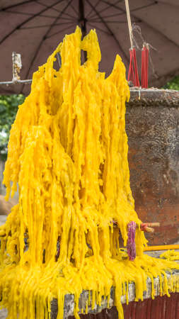 wax of the candle melted on brick.の写真素材