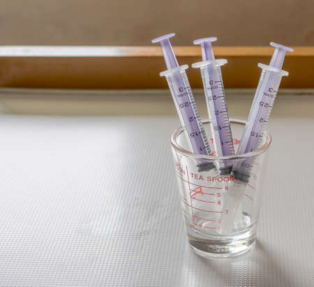 Abstract drugs three times injection syringe