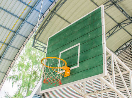 yellow Basketball hoop and green wooden panelの写真素材