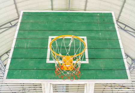 yellow Basketball hoop and green wooden panelの写真素材