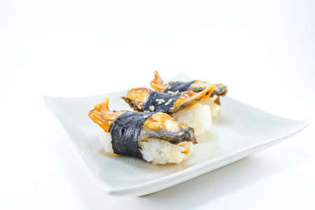 roasted eel (unagi) nigiri on ceramics dishの写真素材