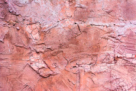 antique Cracked pink concrete wall background imageの写真素材