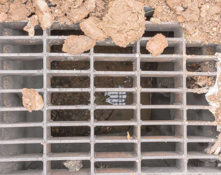 dirty sewage manhole  on the road side image.