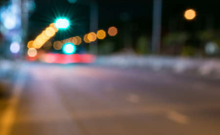 Abstract defocused lights of the night city bokeh background .の写真素材