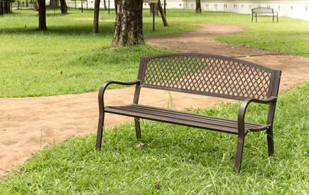 wooden park bench at the public park image.の写真素材