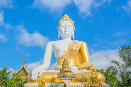 gold Buddha statue in temple of Thailandの写真素材