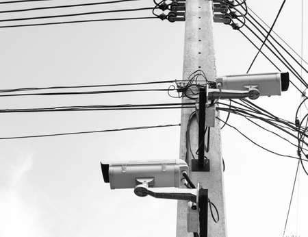 image of cctv camera on electric pole .