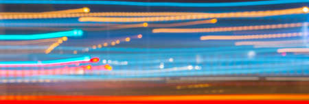 Abstract image of night lights in motion blur in the city image.の写真素材