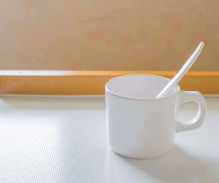 soft focus image of white cup image on the tableの写真素材