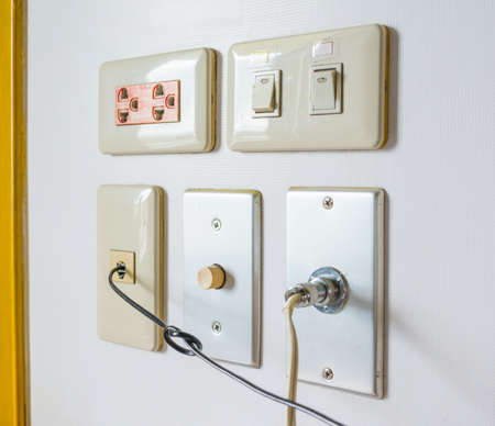 image of a lot of plug on wall .