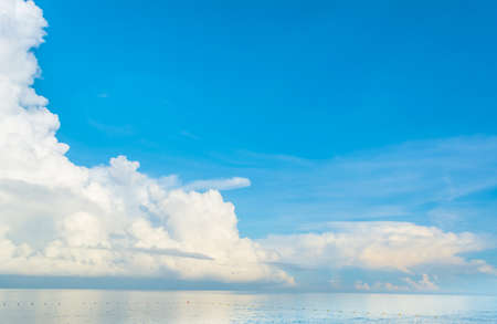 image of blue sea and cloudy blue sky over it.の写真素材