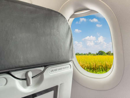 image of  fasten seat belt while seated sign on airplane.の写真素材