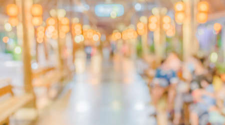 Blur image of shopping street at night with bokeh.の写真素材