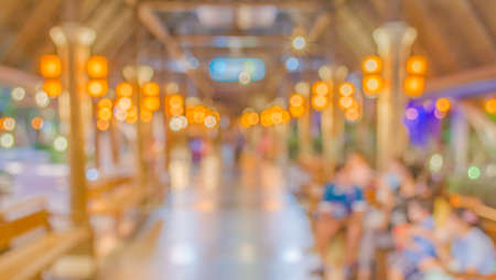 Blur image of shopping street at night with bokeh.の写真素材