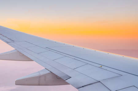View from airplane window to see sky on day time .