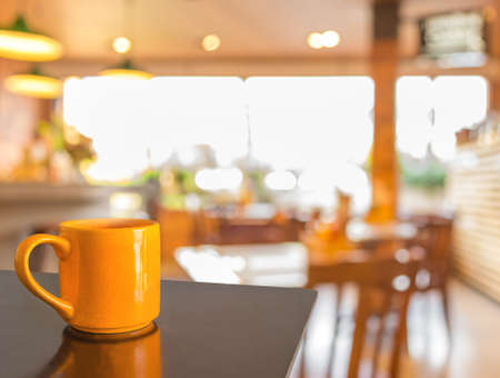 Empty wood table and Coffee shop blur background with bokeh image.の写真素材