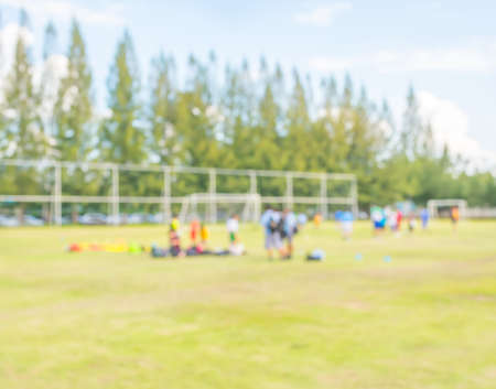 blurred shot of soccer field at school on day time image for background usage .の写真素材