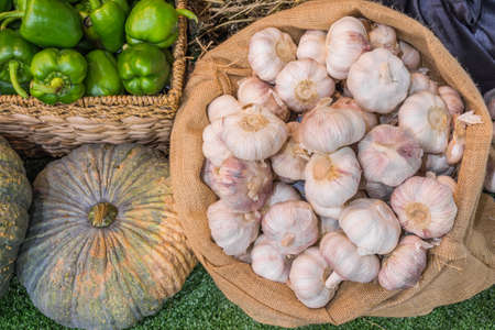 close up shot of garlic and green chili in basket image.の写真素材