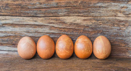 image of Easter eggs on wooden background .の写真素材
