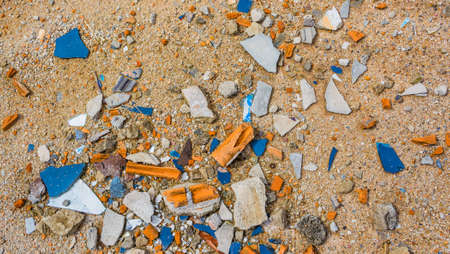 close up texture image of small pebble rock and cracked tile  on  ground for background usage .