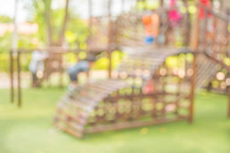 Defocused and blur image of children's playground at public park for background usage.の写真素材