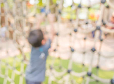 Defocused and blur image of children's playground at public park for background usage.の写真素材