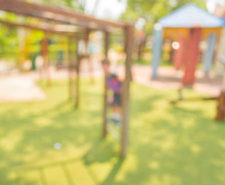 Defocused and blur image of children's playground at public park for background usage.の写真素材