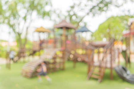 Defocused and blur image of children's playground at public park for background usage.の写真素材
