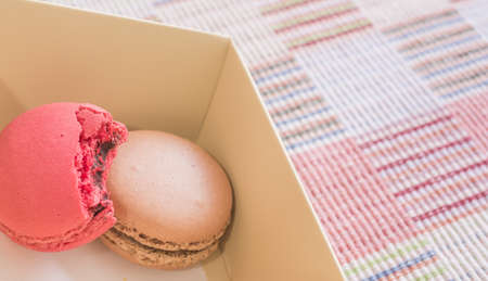 Sweet and colourful french macaroons on cotton cloth background .の写真素材