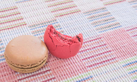 Sweet and colourful french macaroons on cotton cloth background .の写真素材