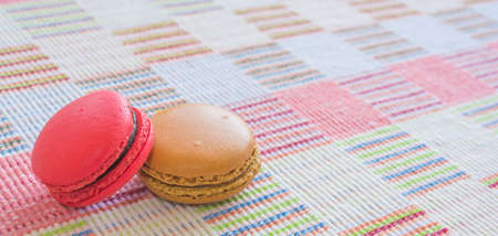 Sweet and colourful french macaroons on cotton cloth background .の写真素材