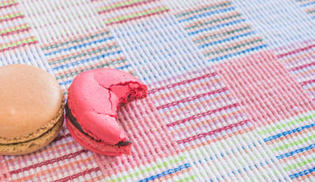 Sweet and colourful french macaroons on cotton cloth background .の写真素材