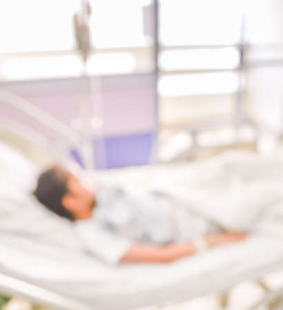 blurred image of Patient with drip in hospital for background usage.の写真素材