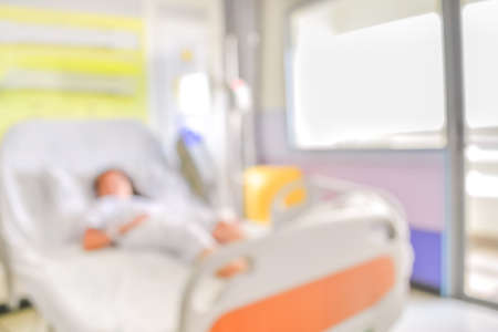 blurred image of Patient with drip in hospital for background usage.の写真素材