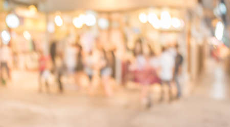 image of blurred background night market on street decorated with festive lights.の写真素材