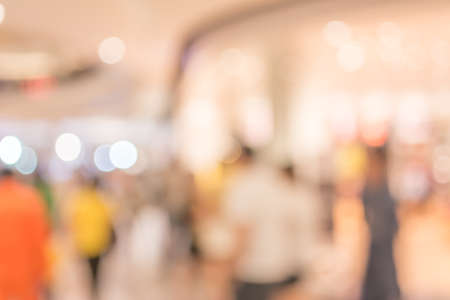 blurred image of shopping mall and people for background usage.