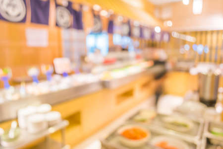 blur image of Abstract blurry sushi counter in vintage style decoration restaurant.の写真素材