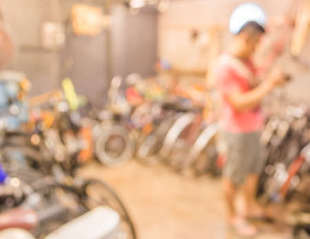 blurred image of lots of parked bikes. Useful as background.の写真素材